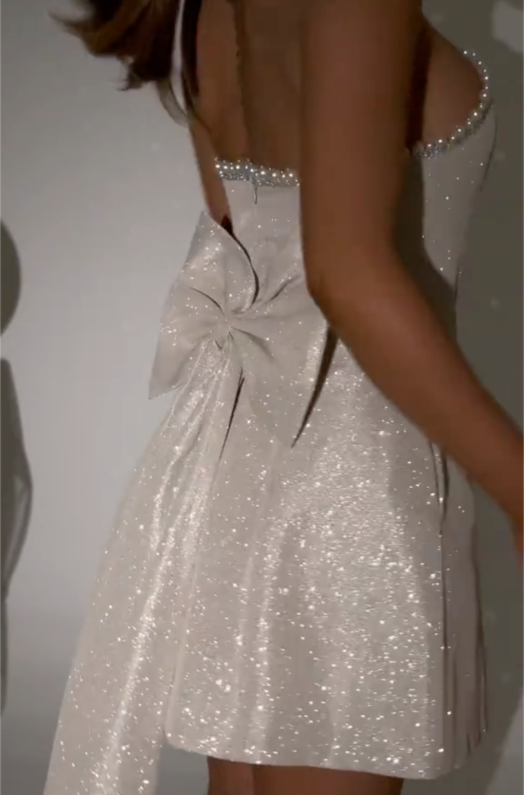 White Glitter Strapless Mini Dress with Pearl Trim Neckline & Oversized Bow Back