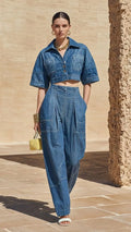 Short denim jacket paired with high-waisted wide-leg denim pants set